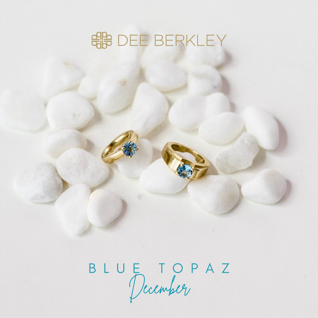 Gold rings with blue topaz on stones.
