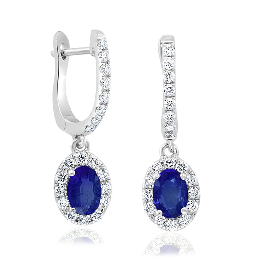 Oval sapphire earrings with diamond accents.