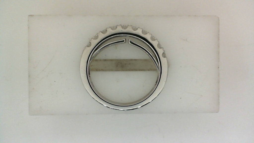 Expandable white gold band with round diamonds.