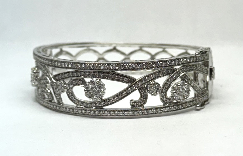 Intricate diamond bangle with swirling design.