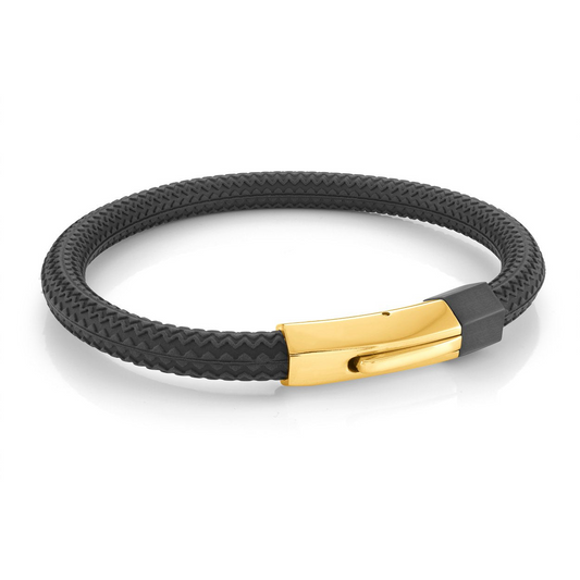 Black rubber bracelet with gold clasp.