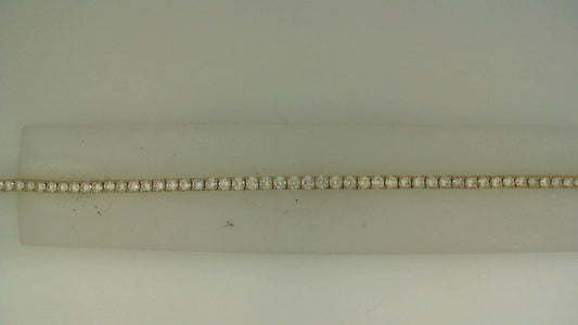 14K yellow gold necklace with round diamonds.