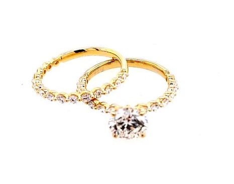 Yellow gold band with lab-grown diamonds.