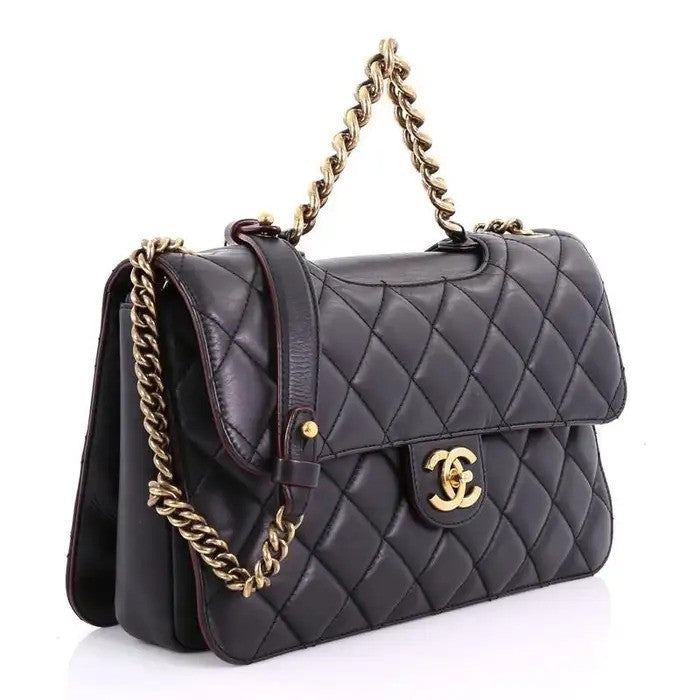 Black quilted leather handbag with gold chain.