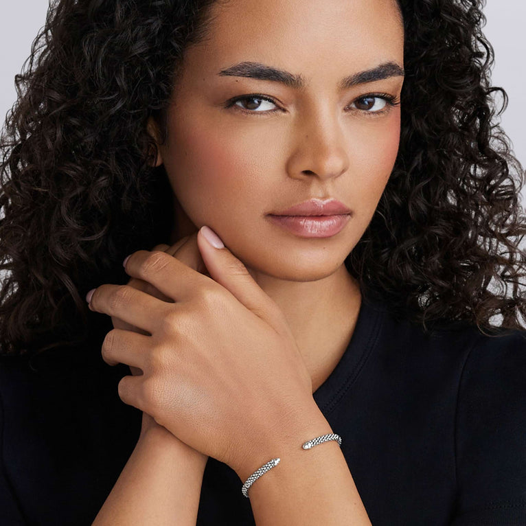 Sterling silver cuff bracelet on wrist.