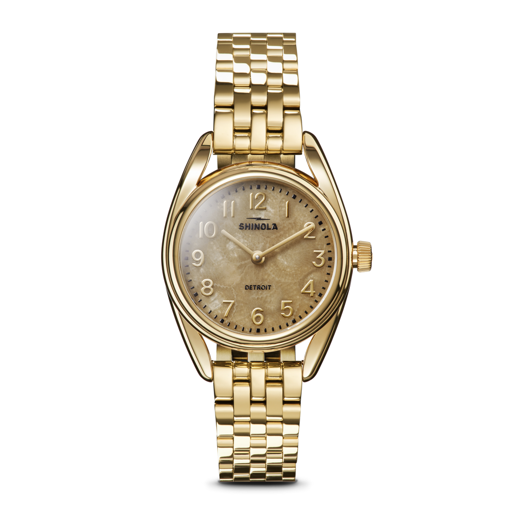 Gold-tone watch with tan dial, stainless steel.