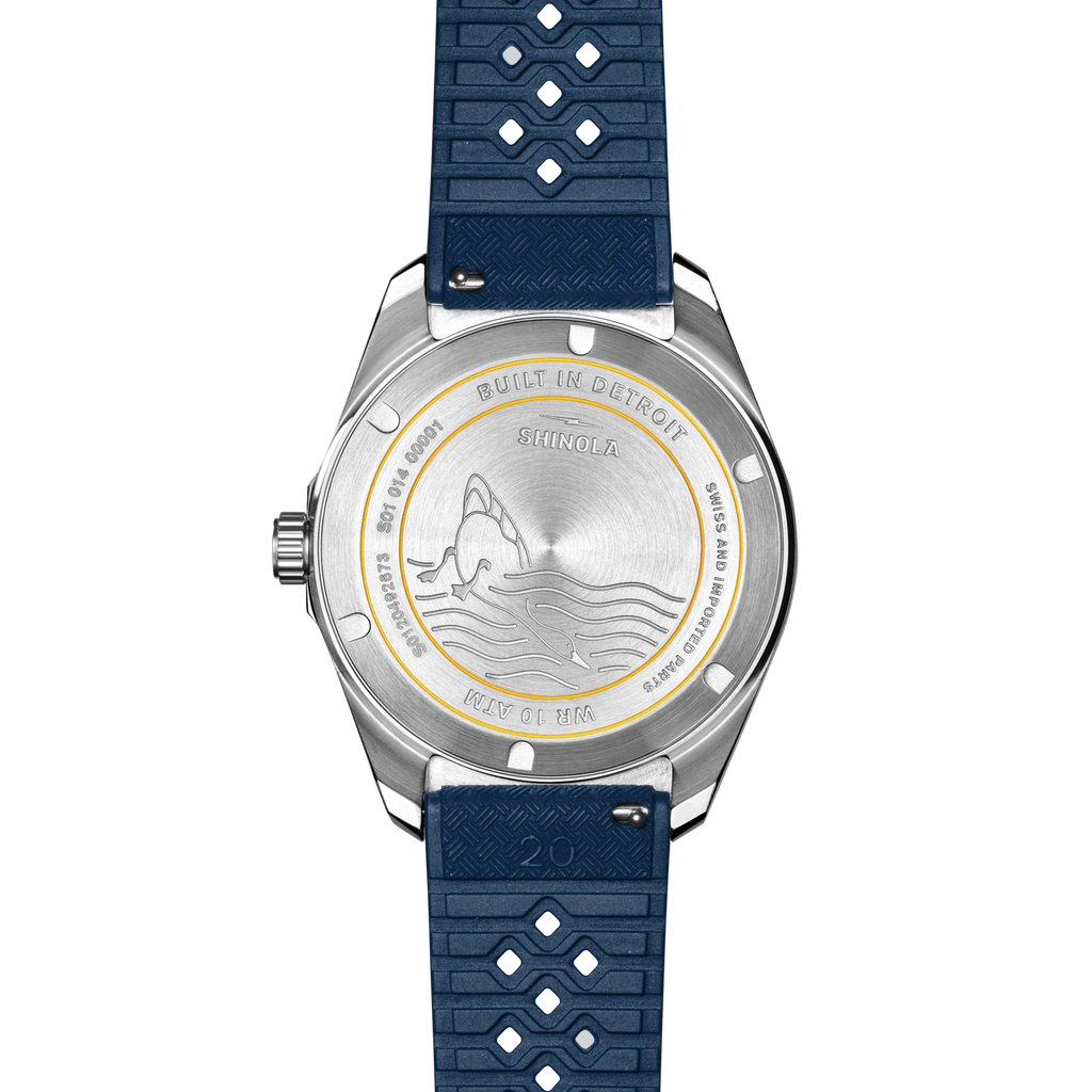 Stainless steel watch with blue rubber strap.