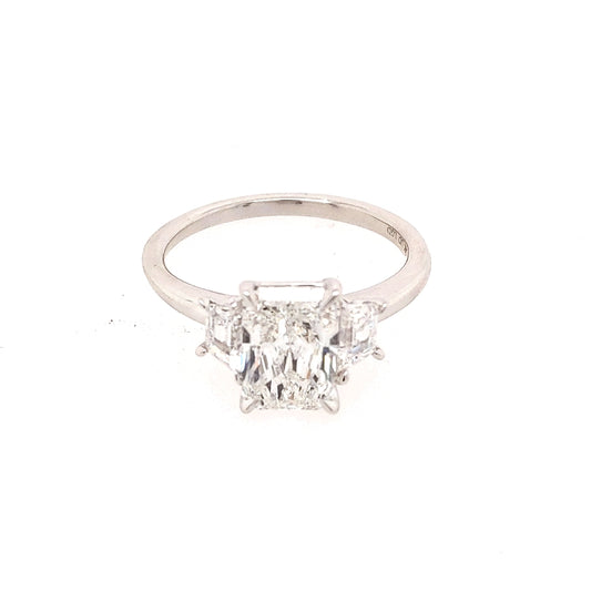Three-stone radiant diamond engagement ring.