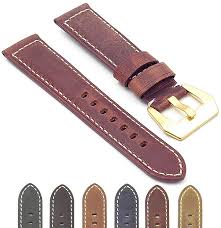 Red leather watch band with tang buckle.