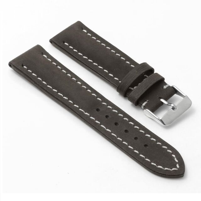 Brown leather watch band with white stitching.