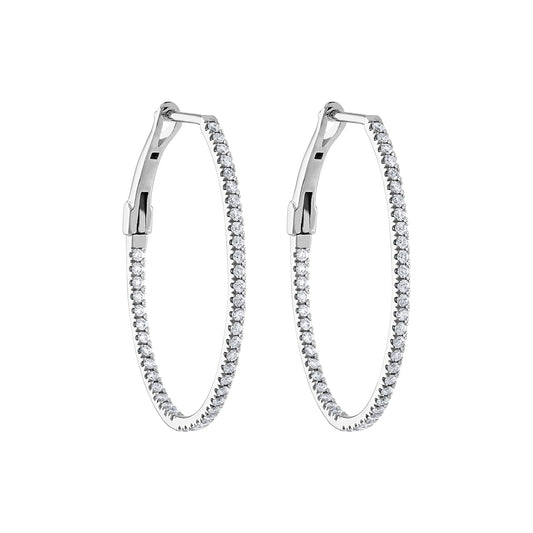 Oval hoop earrings with round diamonds.