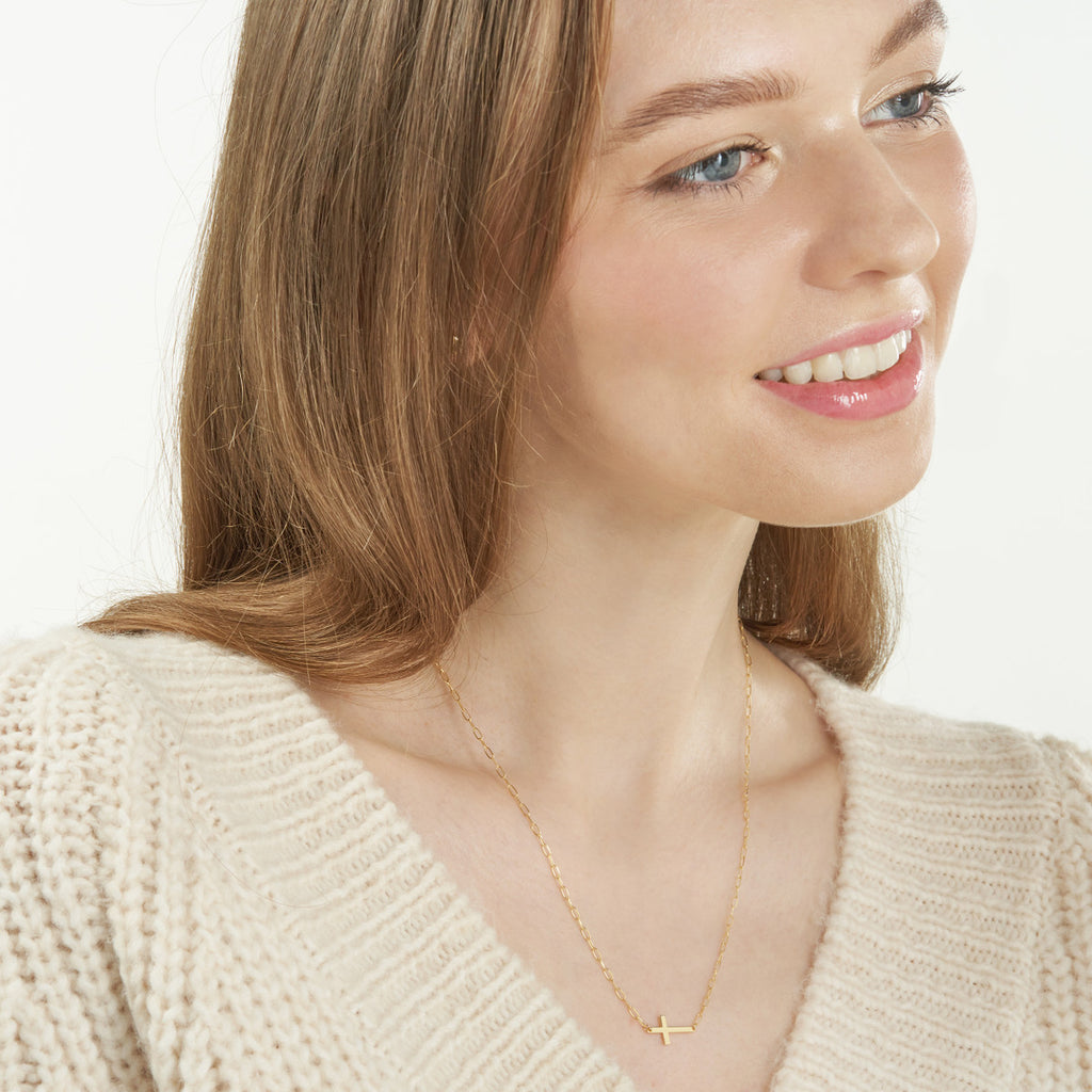 14K yellow gold cross necklace on paperclip chain.