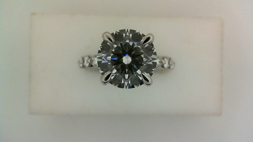 14K white gold ring with round diamonds.