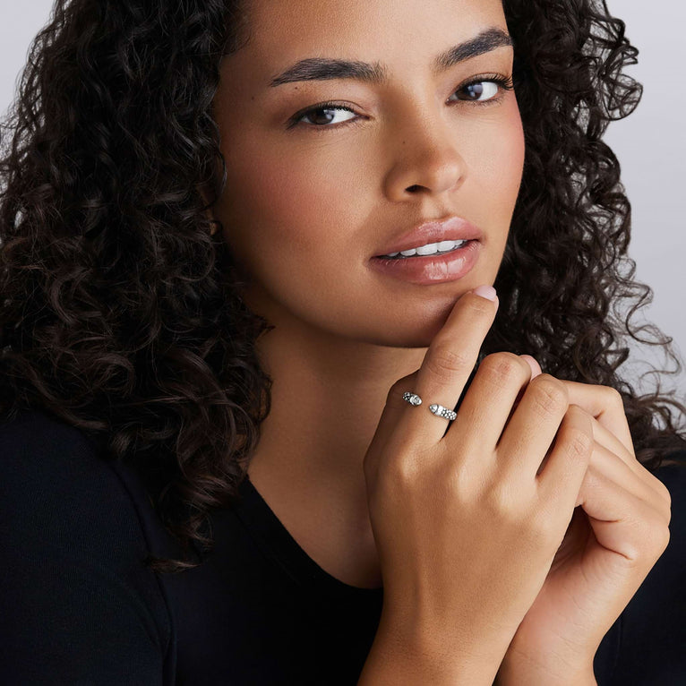 Sterling silver polished caviar design ring.