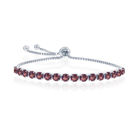 Sterling silver bracelet with red gemstones.
