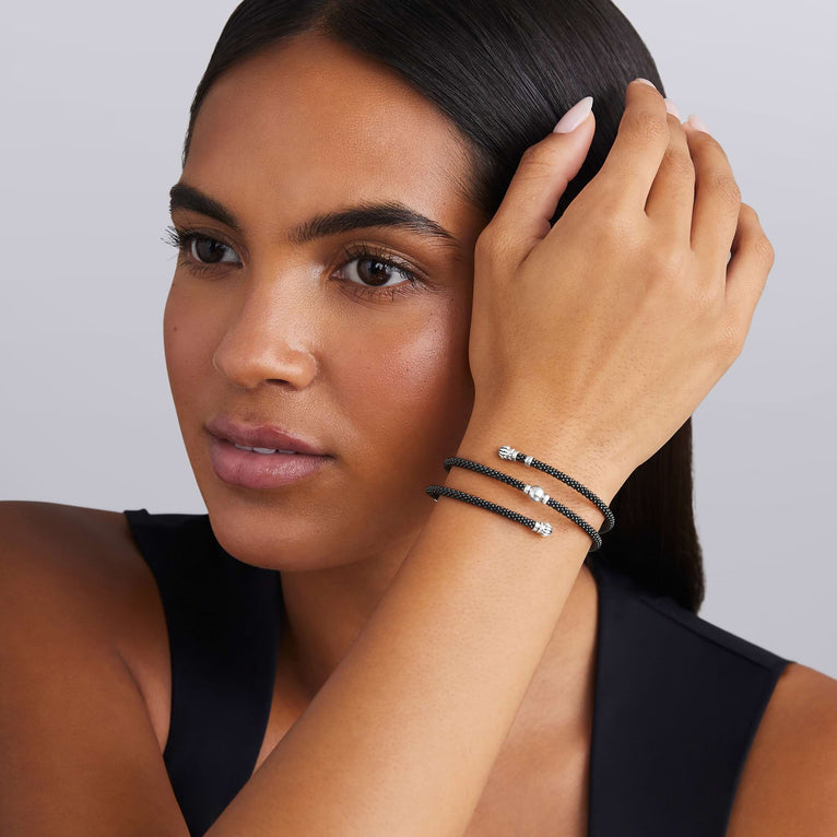Sterling silver black ceramic station bracelet.