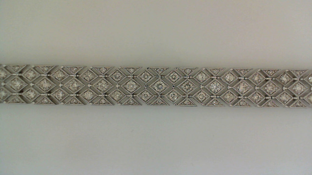 Diamond bracelet with geometric white gold design.