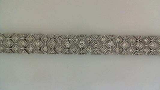 Diamond bracelet with geometric white gold design.