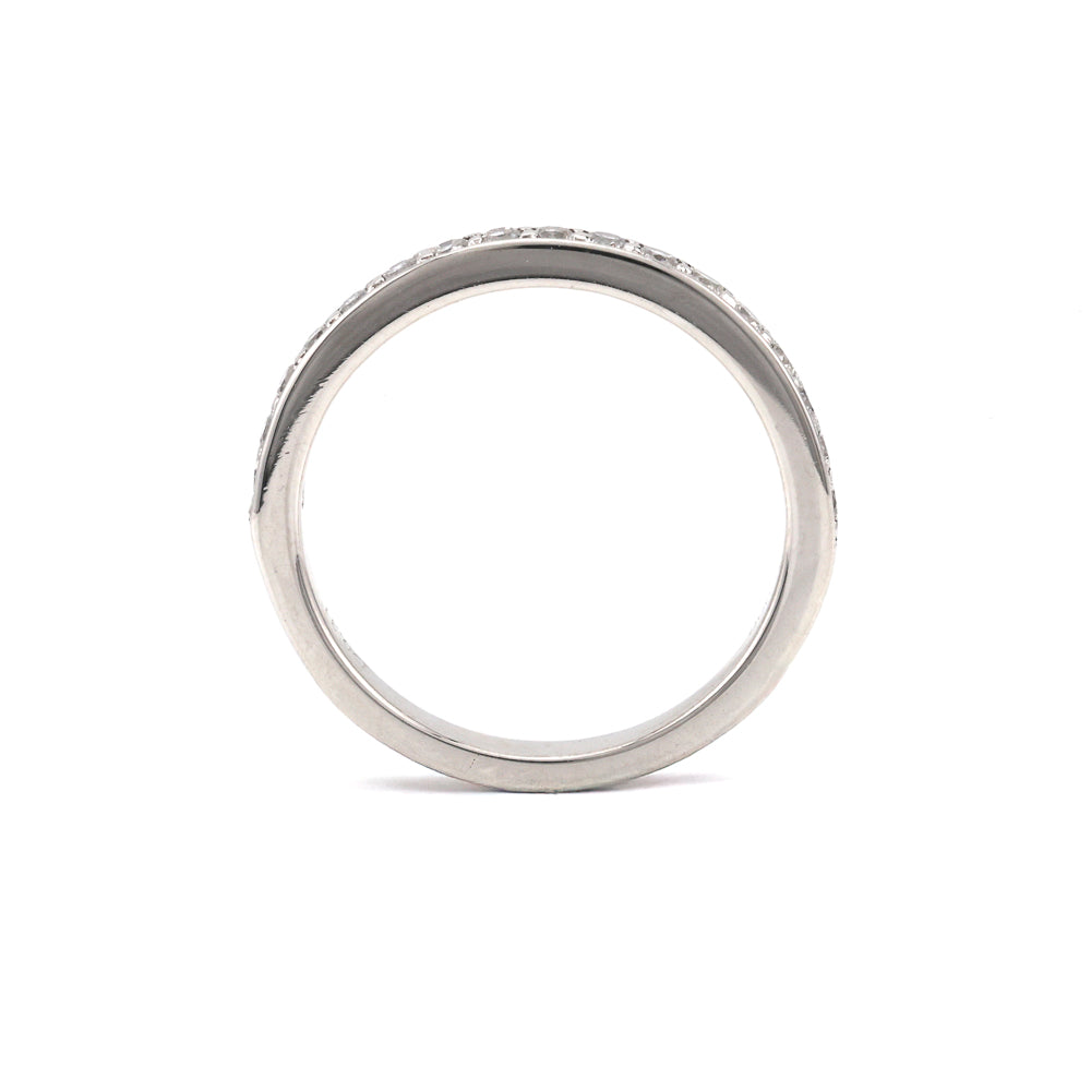 Platinum diamond wedding band with round stones.