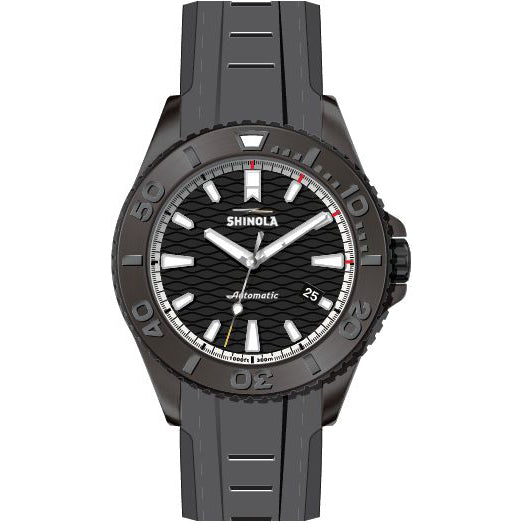 Black metal watch with textured dial.