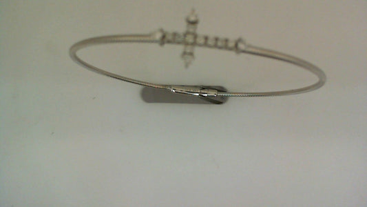 Flexible white gold bangle with round diamonds.