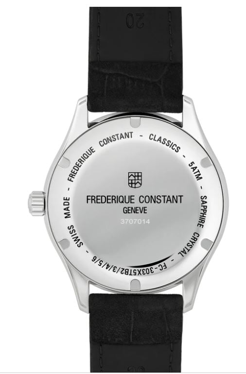 Stainless steel watch back with black leather strap.