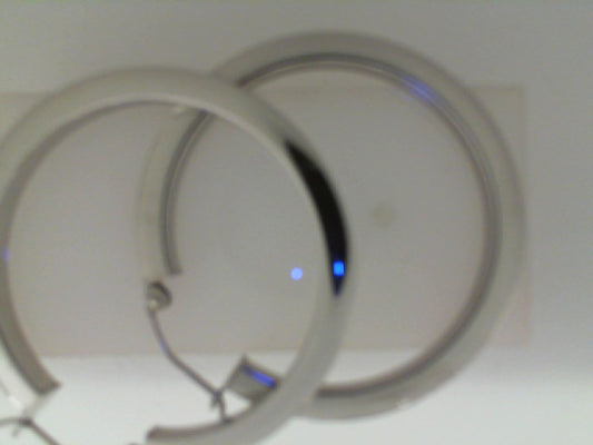 Sterling silver medium hoop earrings, hinged snap.