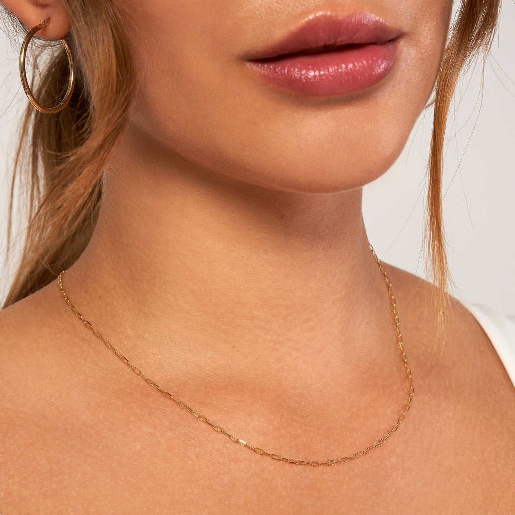 Yellow gold paperclip chain necklace, polished finish.