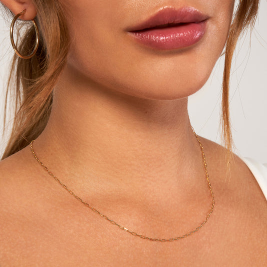Yellow gold paperclip chain necklace.