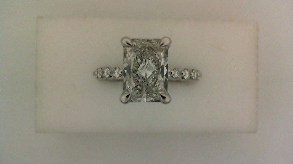 Radiant diamond wedding set in white gold.