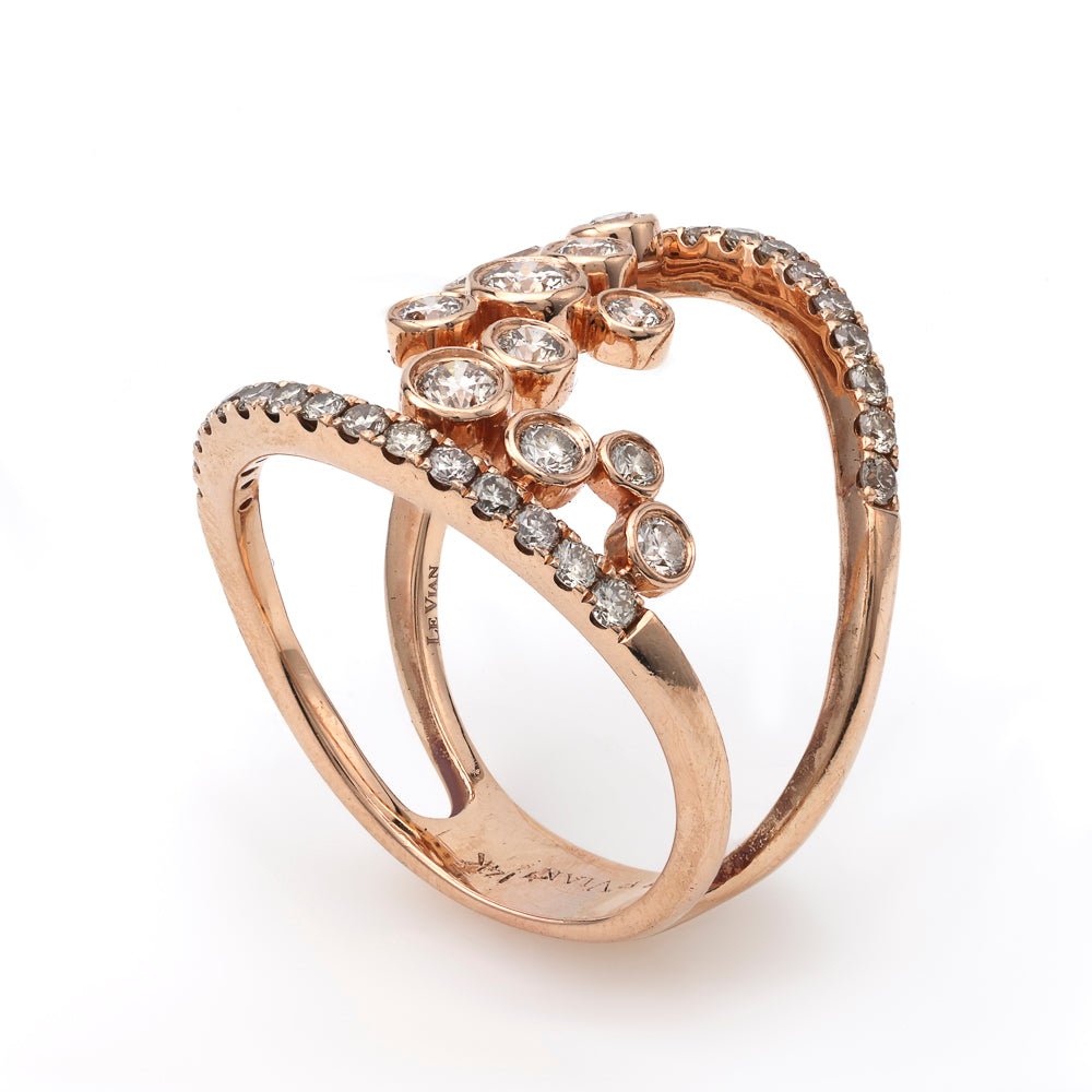 Rose gold ring with round diamond clusters.