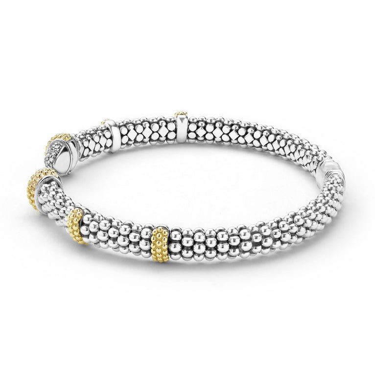 Sterling silver bracelet with gold accents.