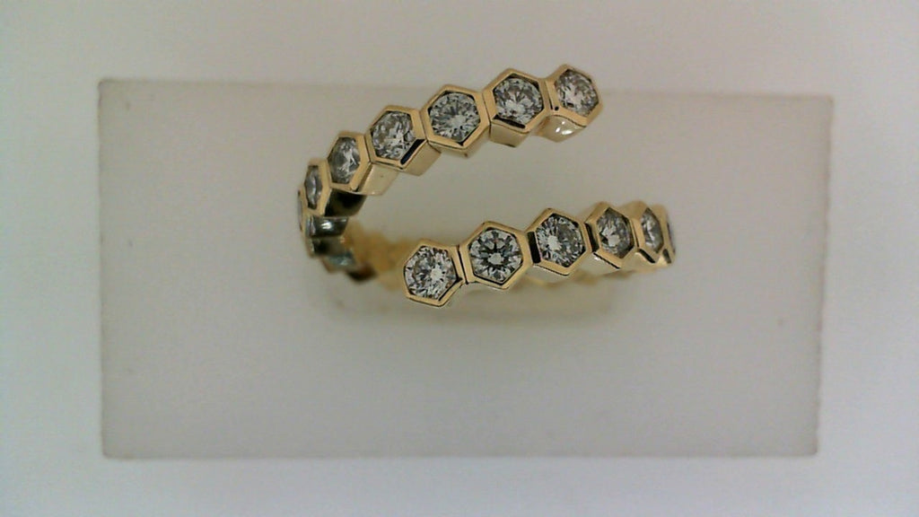 Hexagonal diamond ring in yellow gold.