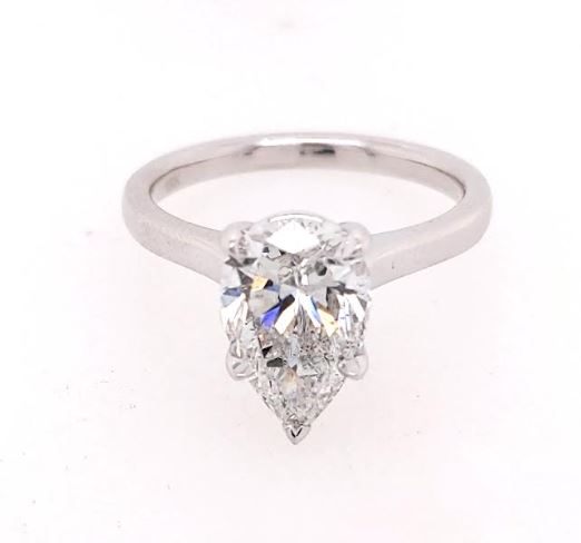 Pear-shaped diamond solitaire on white gold band.