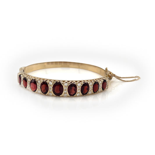 ReMARKable Estate Bangle Color Gemstone Bracelet in 14 Karat Yellow Gold with 9 Oval Garnets 11.00ctw 7mm-9mm