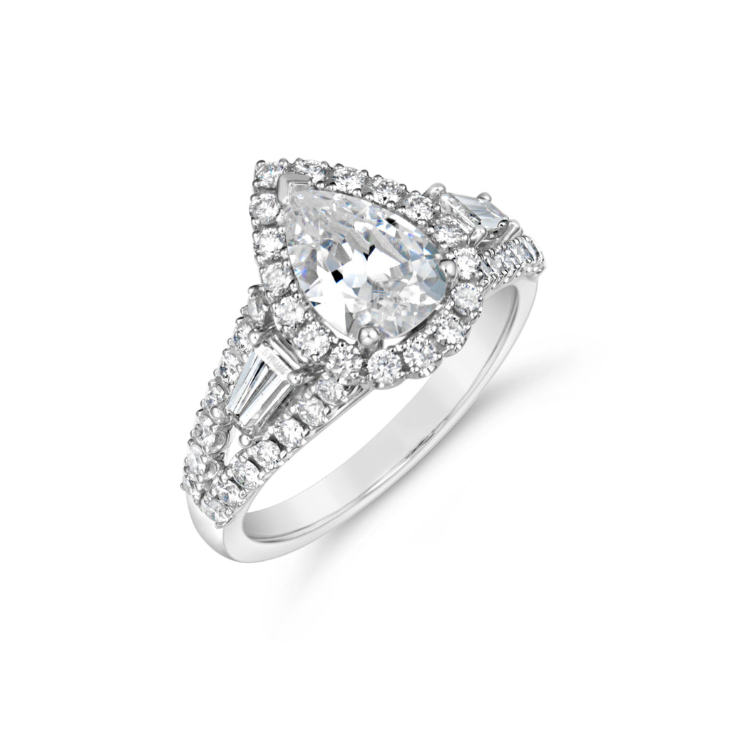 Halo diamond ring with tapered baguettes.