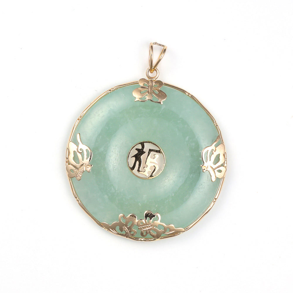 Green jade pendant with gold accents.