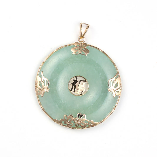 Green jade pendant with gold accents.
