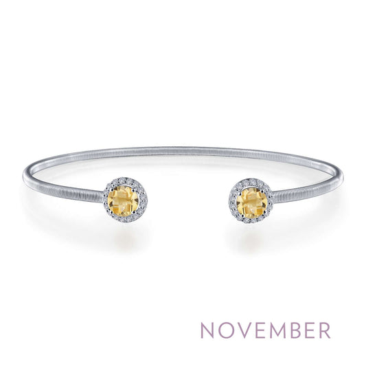 Platinum bangle with citrine gemstones.