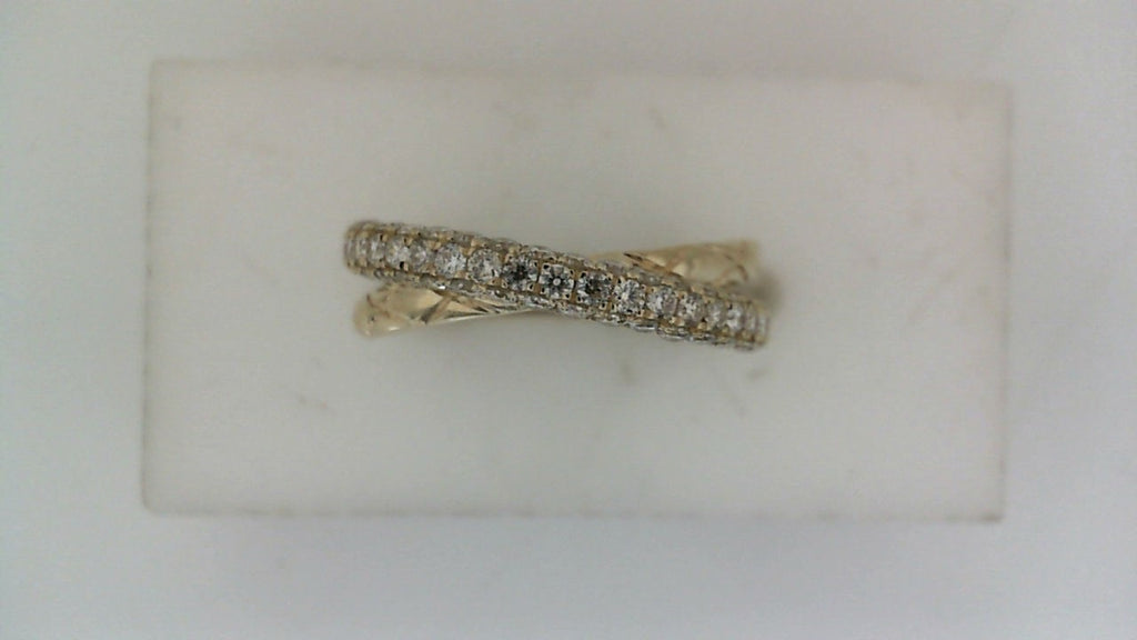 Crisscross diamond ring in tri-tone gold.