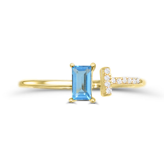 Baguette blue topaz ring with diamonds.
