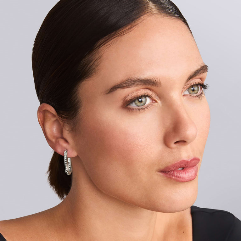 Sterling silver medium hoop earrings, polished finish.