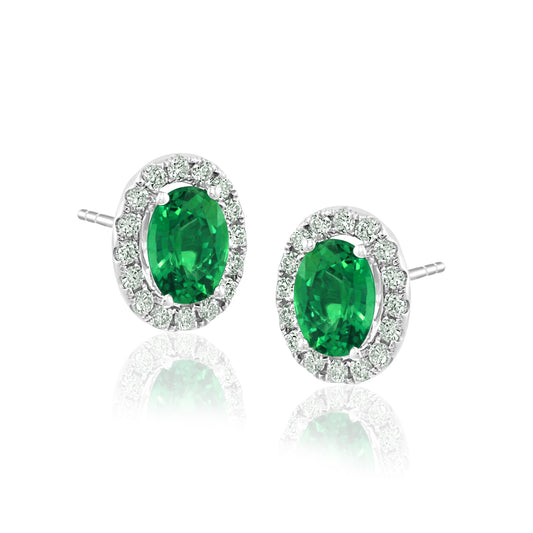 Oval emerald diamond halo stud earrings.