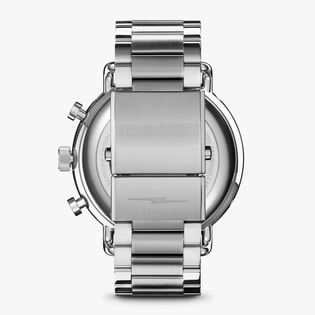Stainless steel chronograph watch back view.