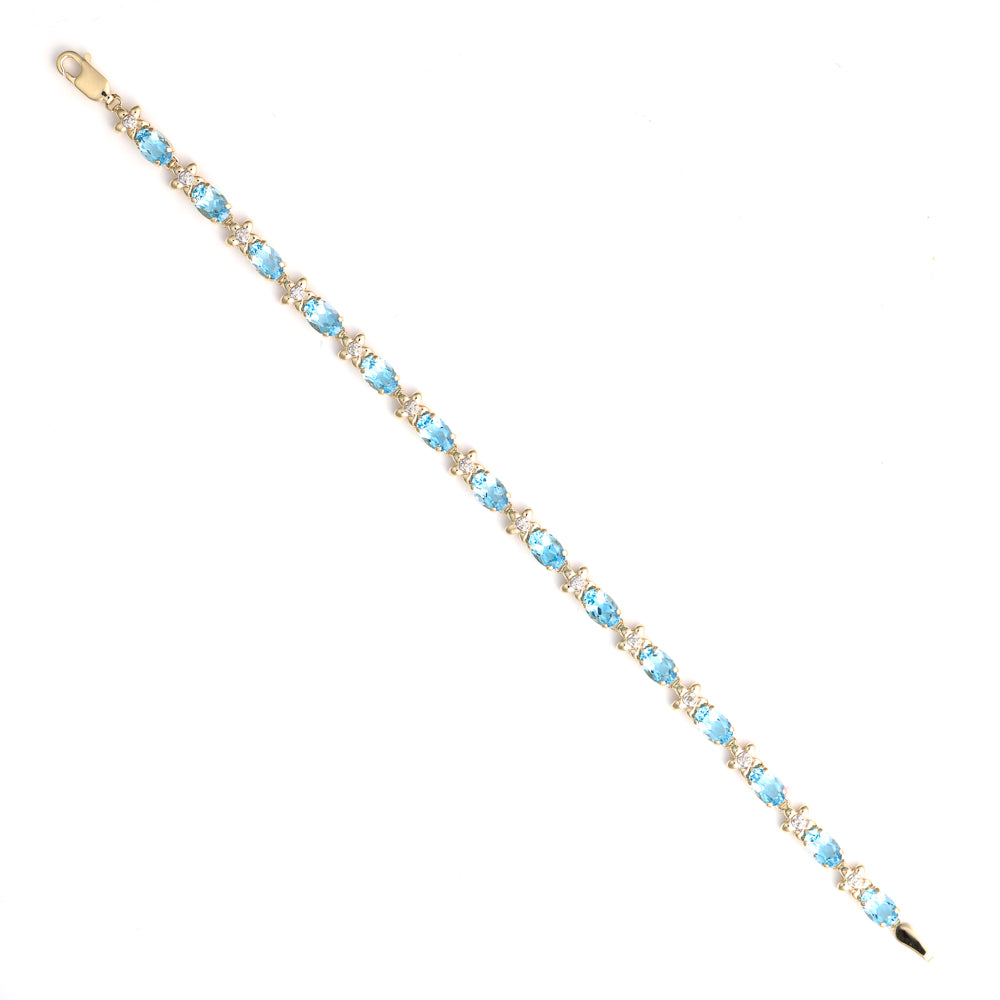14K yellow bracelet with blue topazes.