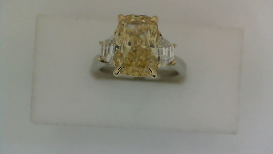 Three-stone yellow diamond engagement ring.