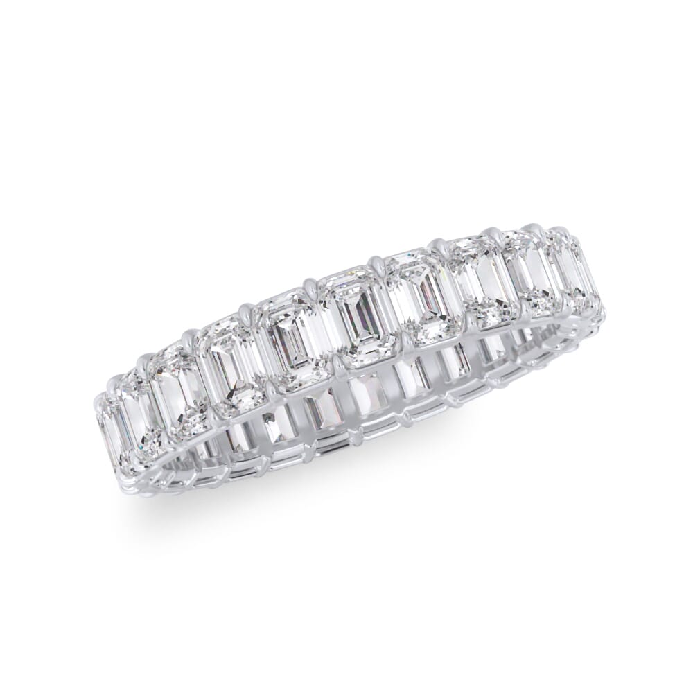 Emerald-cut diamond eternity band in white gold.