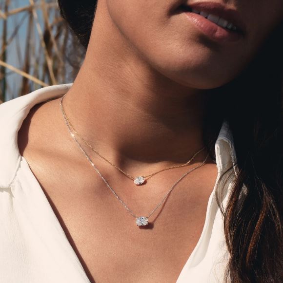 Oval lab-grown diamond necklace on model.