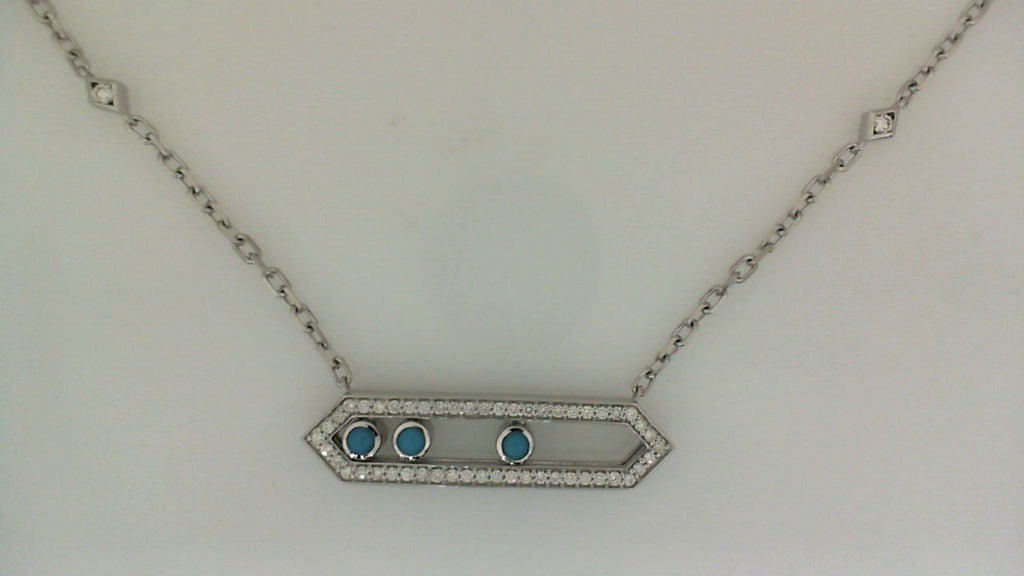 Silver necklace with blue gemstones and diamond accents.