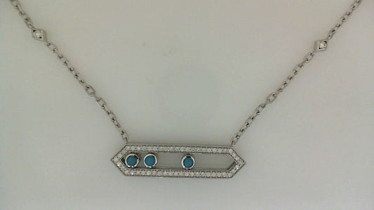 Silver necklace with blue gemstones and diamond accents.